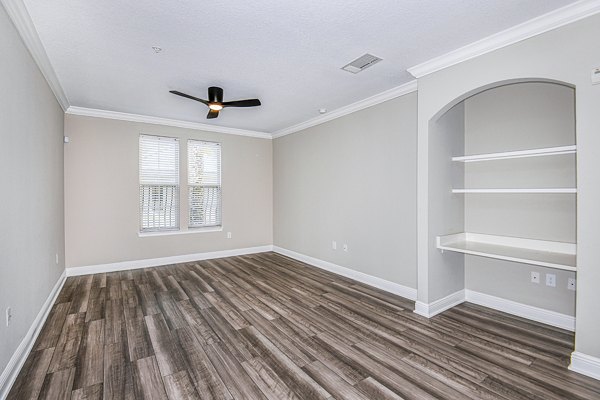 living room and home office area at The Village at Lake Lily Apartments