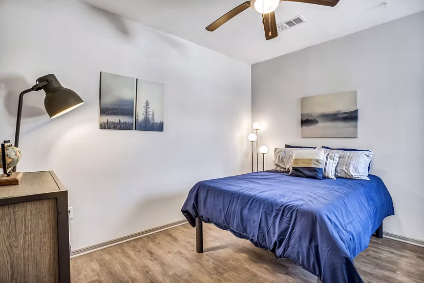 Bedroom with plush bedding and stylish decor at Haven at M Apartments
