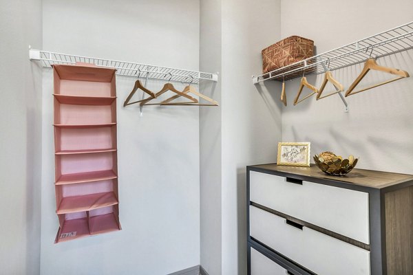Cozy bedroom with modern decor at Haven at M Apartments
