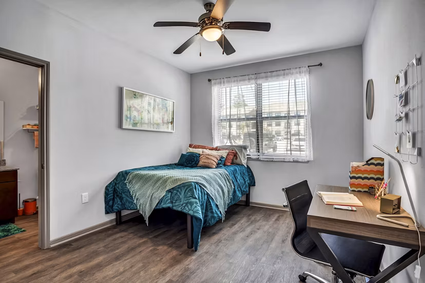Luxurious bedroom featuring modern decor and ample natural light at Haven at M Apartments
