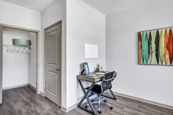 Cozy bedroom with modern furnishings at Haven at M Apartments, featuring luxury finishes and ample natural light in central location