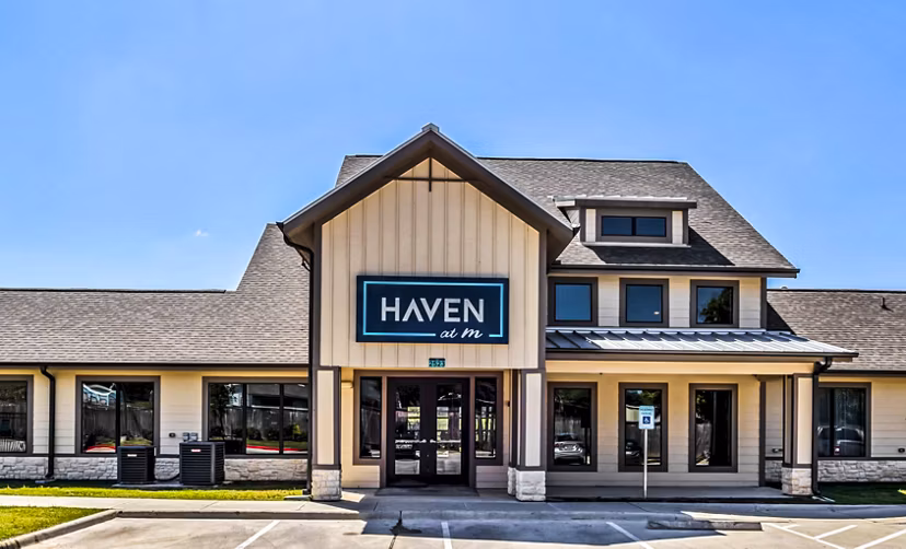 Stylish clubhouse with modern furnishings at Haven at M Apartments for resident gatherings