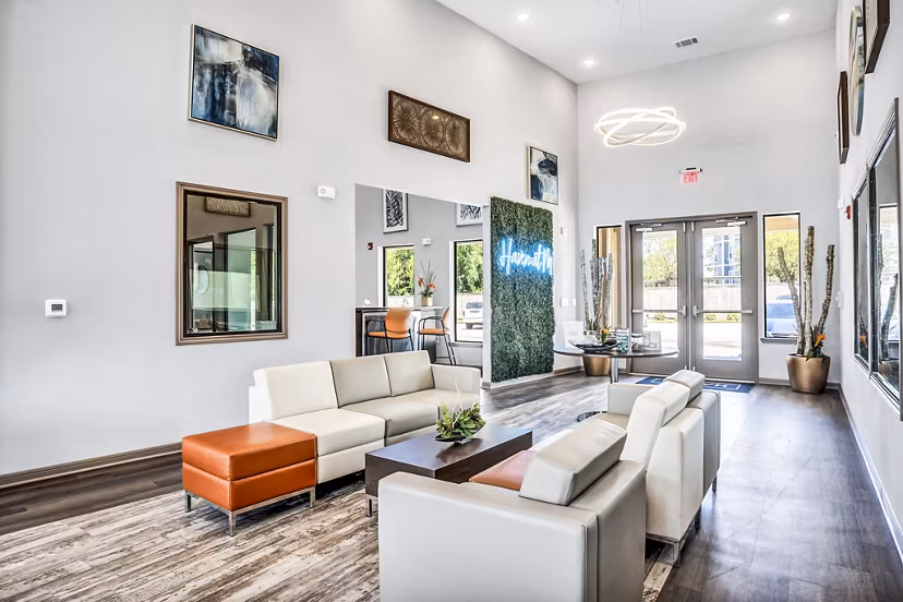 Clubhouse featuring modern furnishings and social spaces at Haven at M Apartments