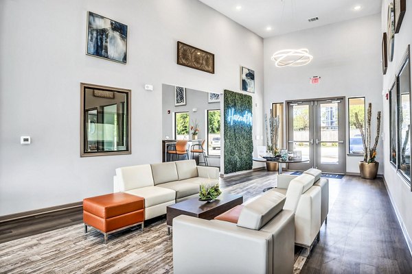 Clubhouse featuring modern furnishings and social spaces at Haven at M Apartments