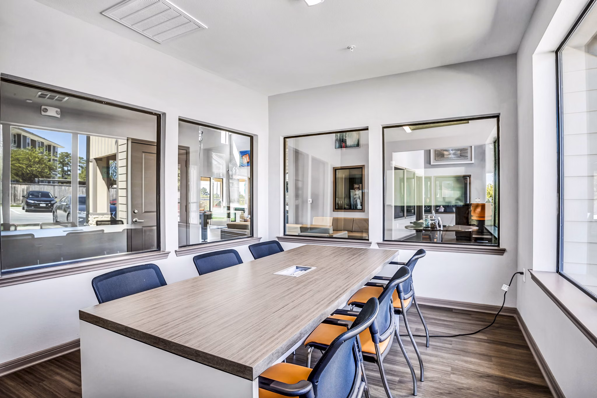 Clubhouse study area with modern seating and ample lighting at Haven at M Apartments