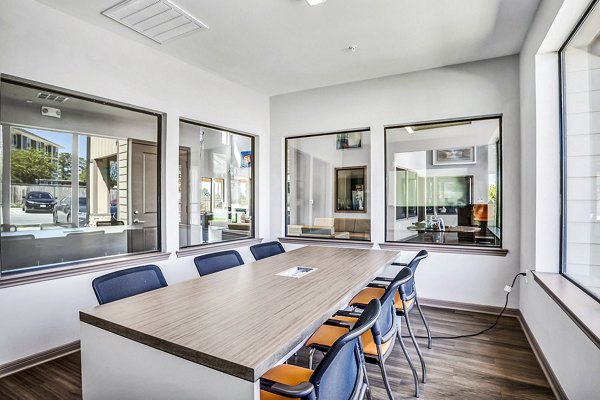 Clubhouse study area with modern seating and ample lighting at Haven at M Apartments