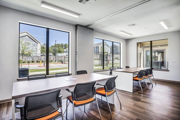 Quiet clubhouse study area with comfortable seating at Haven at M Apartments, offering a serene environment for focused work or study