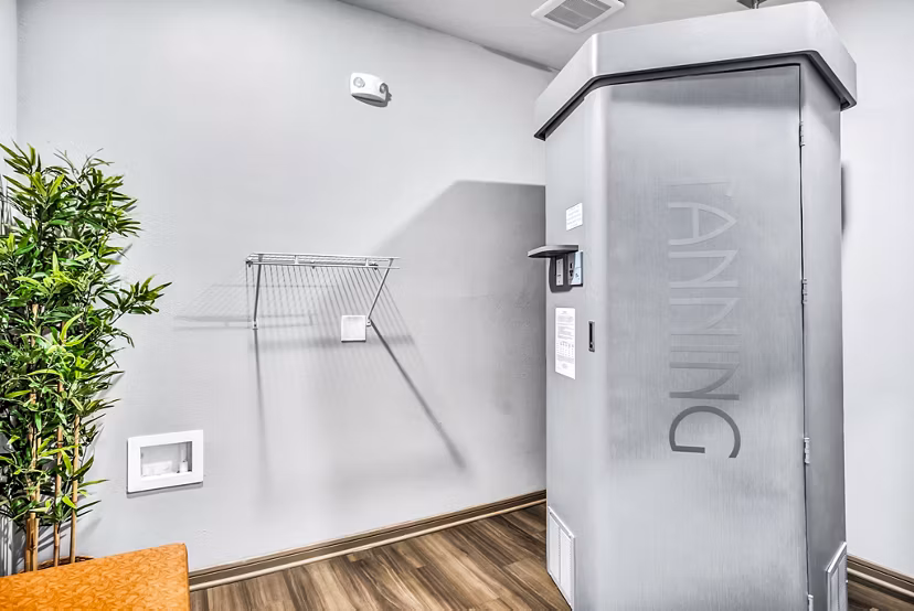 Heated tanning booth at the Haven at M Apartments clubhouse offering a relaxing amenity for residents