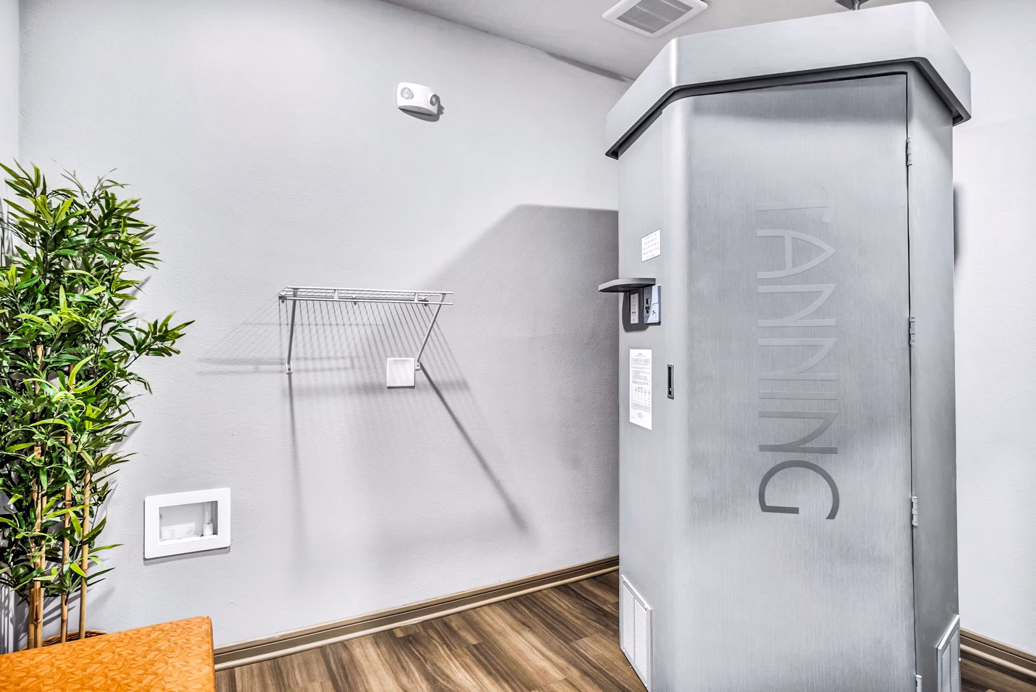 Heated tanning booth at the Haven at M Apartments clubhouse offering a relaxing amenity for residents