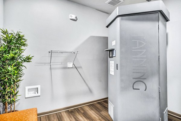 Heated tanning booth at the Haven at M Apartments clubhouse offering a relaxing amenity for residents