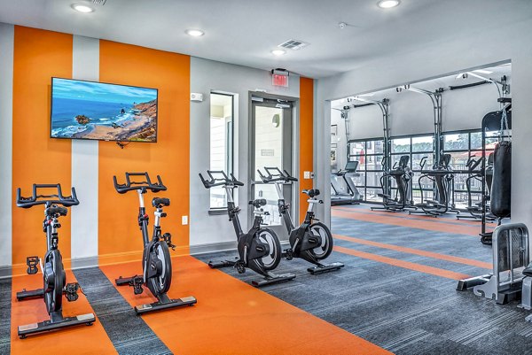 State-of-the-art fitness center and spin studio at Haven at M Apartments, offering modern exercise equipment and vibrant workout environment