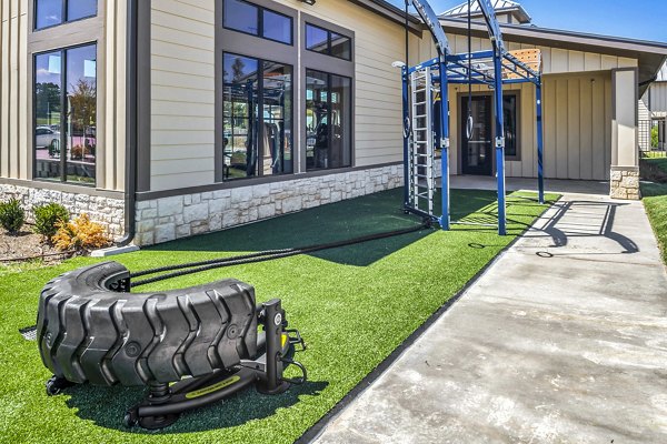 Outdoor fitness center for residents at Haven at M Apartments, featuring modern exercise equipment and spacious workout area, enhancing active lifestyle options