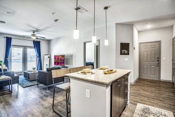 Dining room with modern appliances and elegant decor in Haven at M Apartments