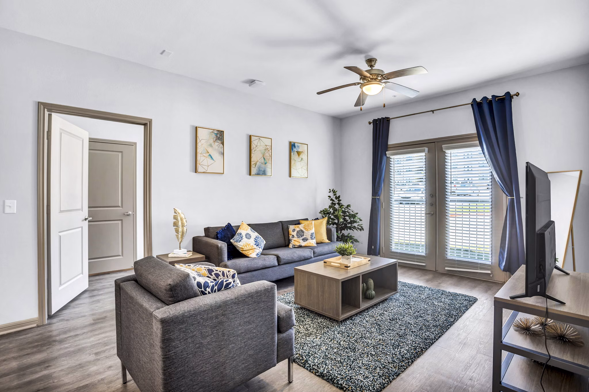 Bright living room with modern furnishings at Haven at M Apartments