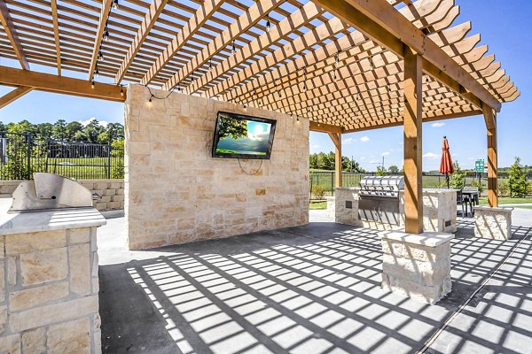 Grill and lounge area on the patio at Haven at M Apartments