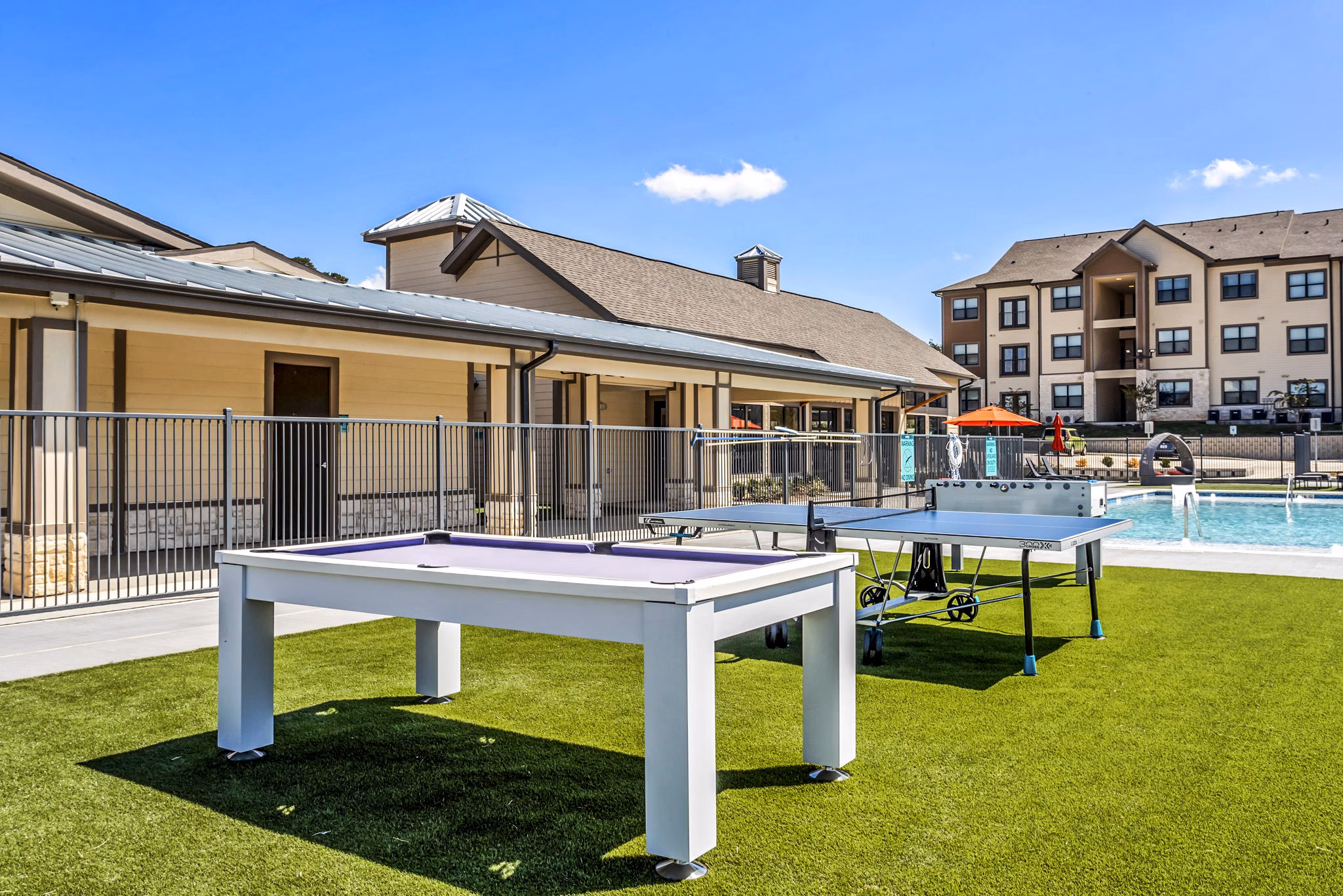 Modern recreational area at Haven at M Apartments featuring outdoor seating and vibrant landscaping
