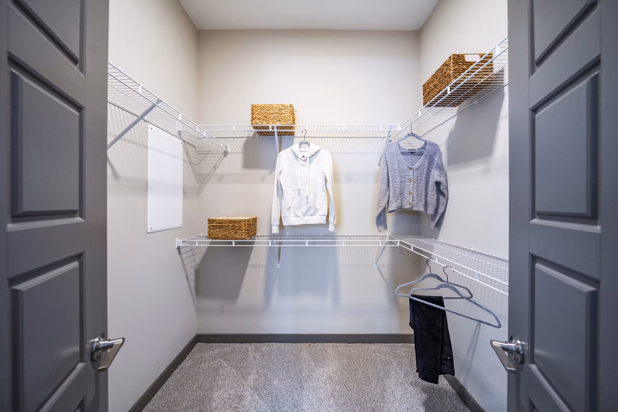Spacious bedroom closet with built-in shelving in Sterling at Stonecrest Apartments