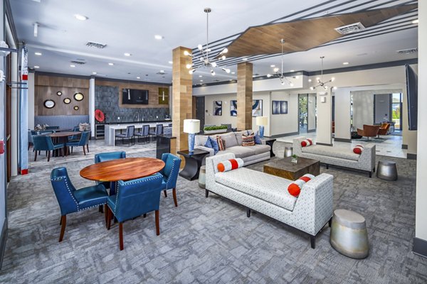 Clubhouse with modern decor and cozy seating at Sterling at Stonecrest Apartments