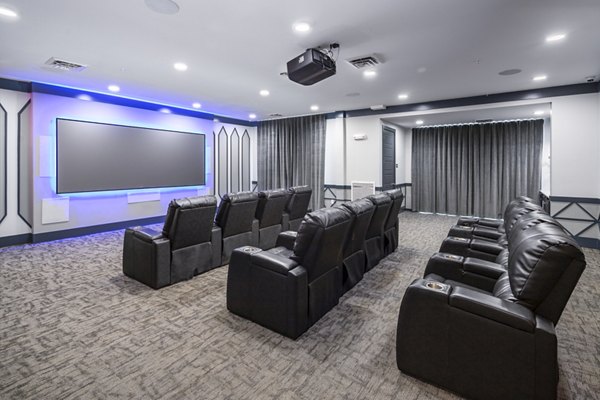 Clubhouse theater with plush seating at Sterling at Stonecrest Apartments, ideal for movie nights and social gatherings