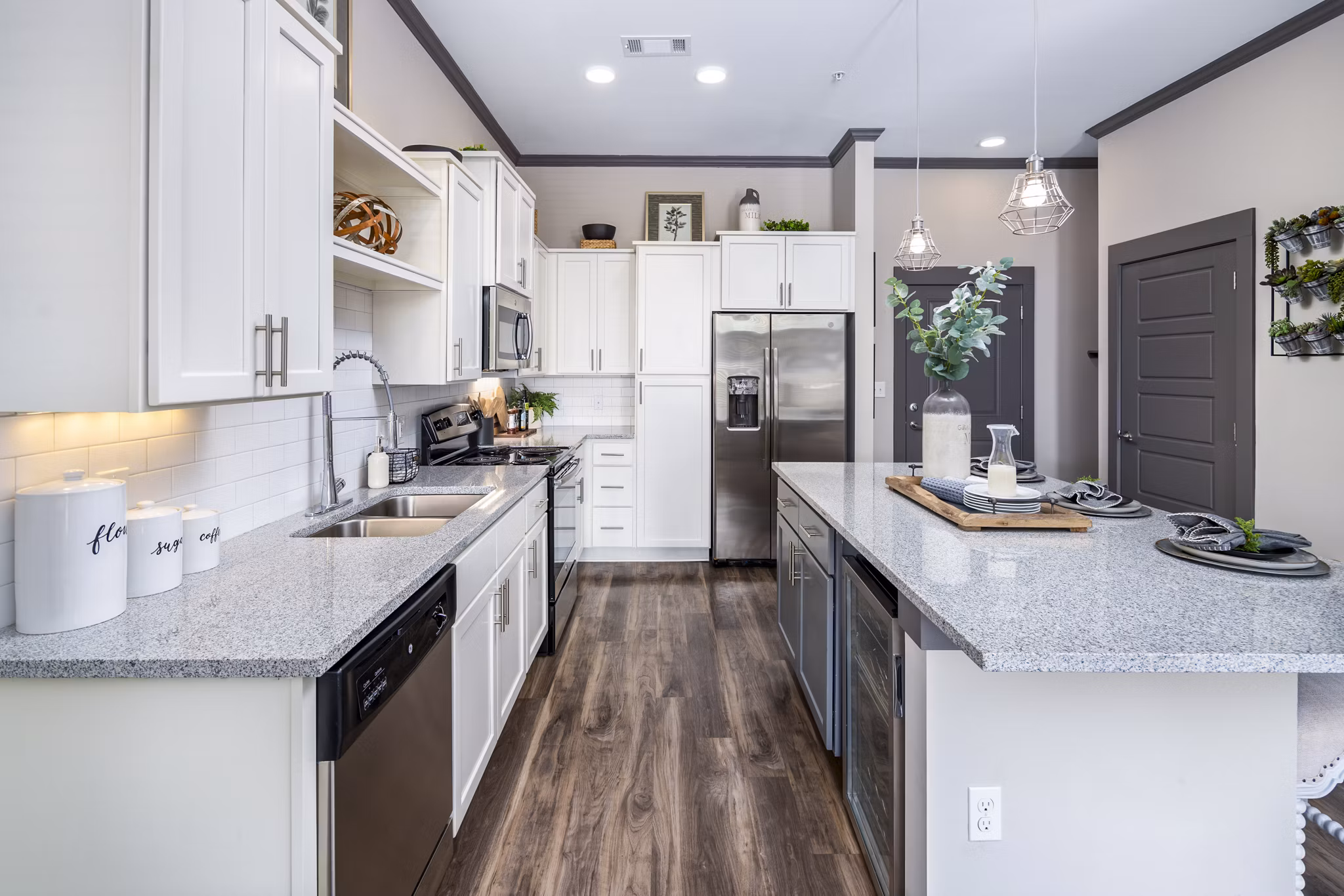 Modern kitchen with stainless steel appliances at Sterling at Stonecrest Apartments