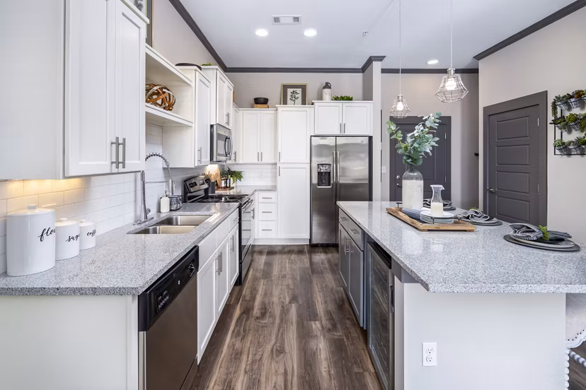 Modern kitchen with stainless steel appliances at Sterling at Stonecrest Apartments