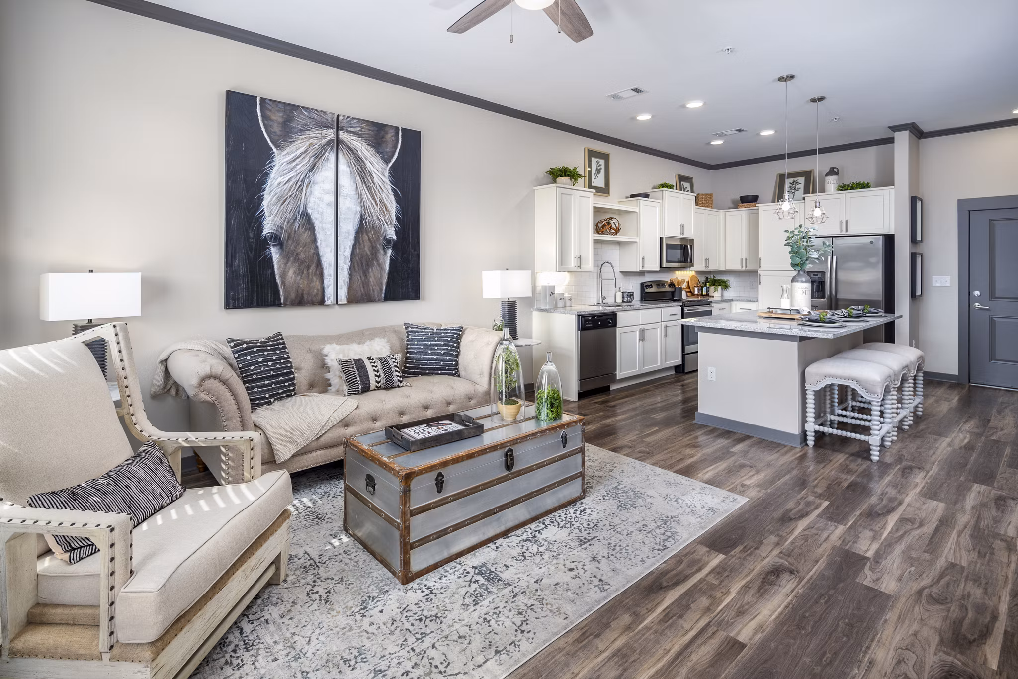 Contemporary living room with plush seating and natural light at Sterling at Stonecrest Apartments