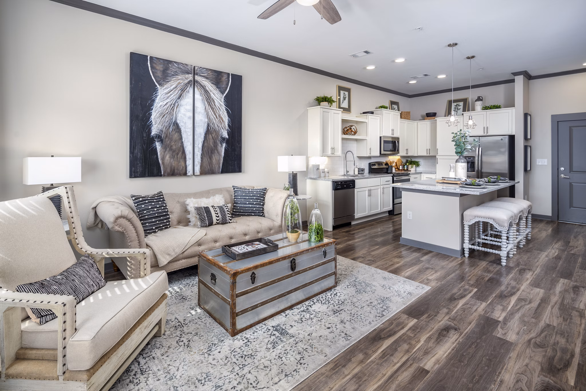 Contemporary living room with plush seating and natural light at Sterling at Stonecrest Apartments