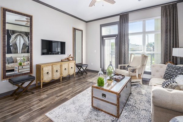 Spacious living room with modern decor in Sterling at Stonecrest Apartments