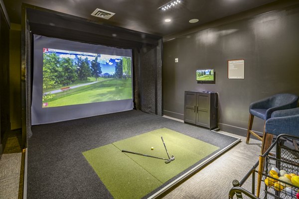 Indoor virtual golf driving range at Sterling at Stonecrest, offering luxury amenities for residents seeking an innovative golfing experience