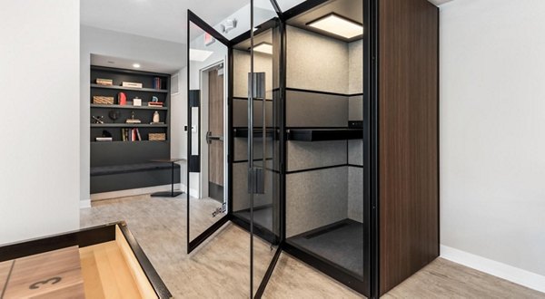Clubhouse featuring modern design and social lounge at District 1860 Apartments, luxury community offering premium amenities