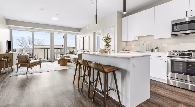 Modern kitchen with stainless steel appliances in District 1860 Apartments