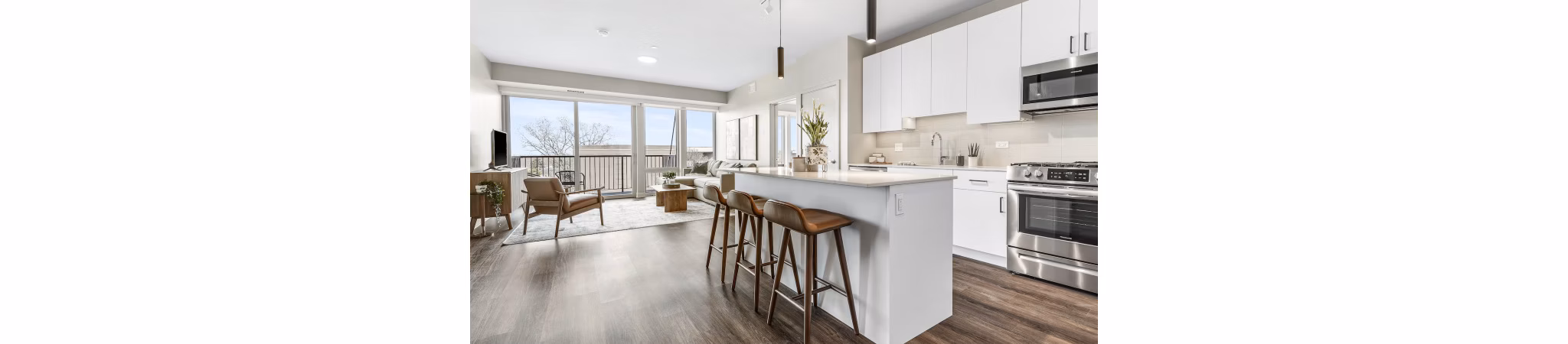 Modern kitchen with stainless steel appliances in District 1860 Apartments
