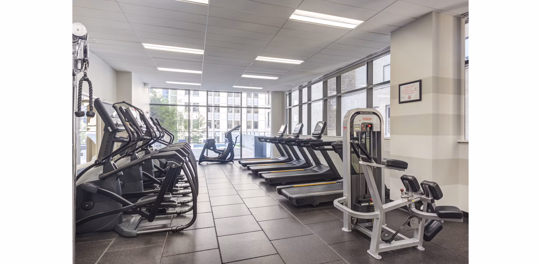 State-of-the-art fitness center with modern equipment at Lake & Wells luxury apartments