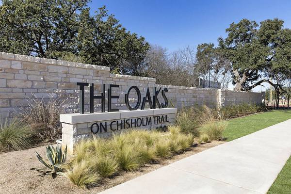 signage at The Oaks on Chisholm Trail Apartments