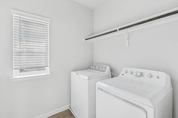 laundry room at The Oaks on Chisholm Trail Apartments