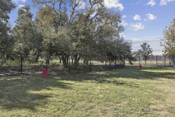 dog park at The Oaks on Chisholm Trail Apartments