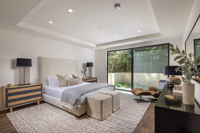 Luxury bedroom with elegant furnishings at The Alfred Apartments