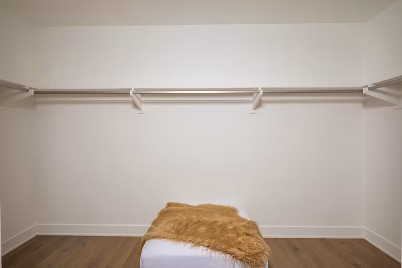 Closet with spacious shelving at The Alfred Apartments, perfect for organized luxury living