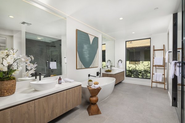 Modern bathroom with marble countertop in The Alfred Apartments