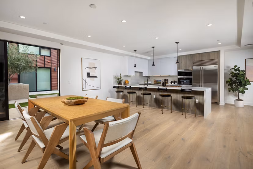 Modern dining area with elegant furnishings at The Alfred Apartments in a luxury Greystar community