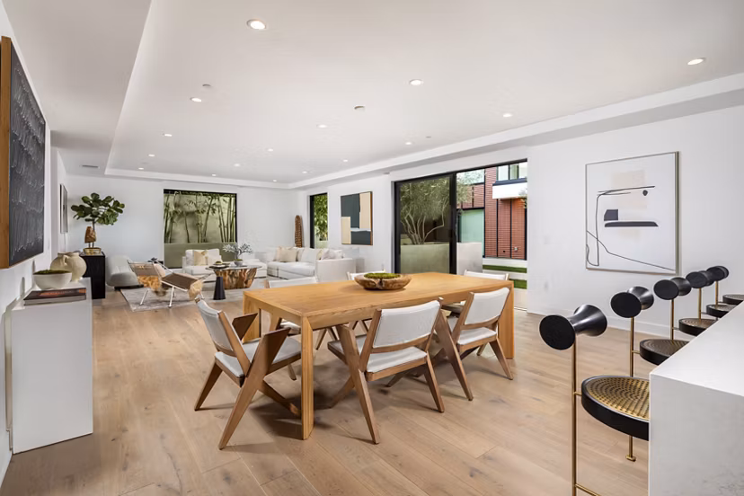 Dining area with modern decor and elegant lighting at The Alfred Apartments