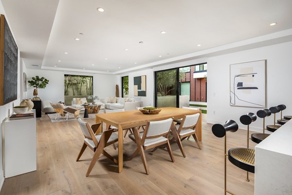 Dining area with modern decor and elegant lighting at The Alfred Apartments