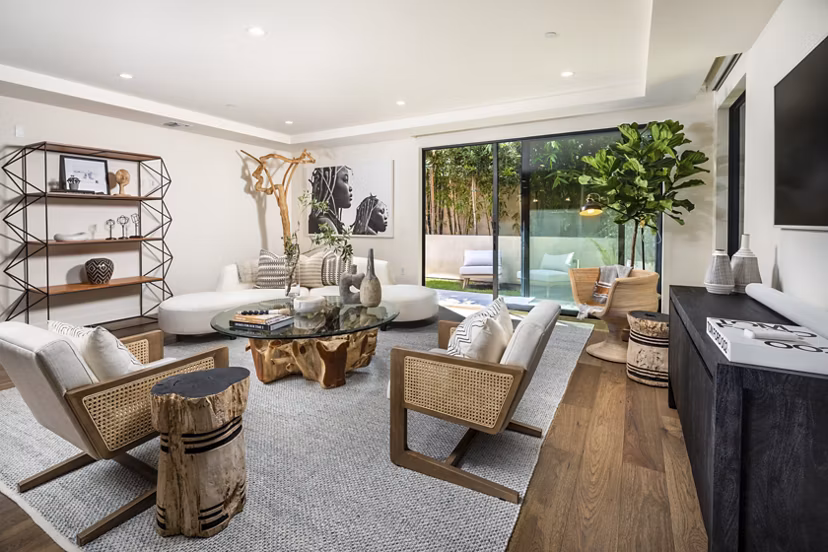 Interior Living Room: Modern living room with stylish decor and large windows at The Alfred Apartments, a Greystar luxury property