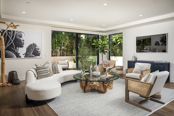 Spacious living room with modern decor at The Alfred Apartments, a luxury Greystar property in the heart of the city