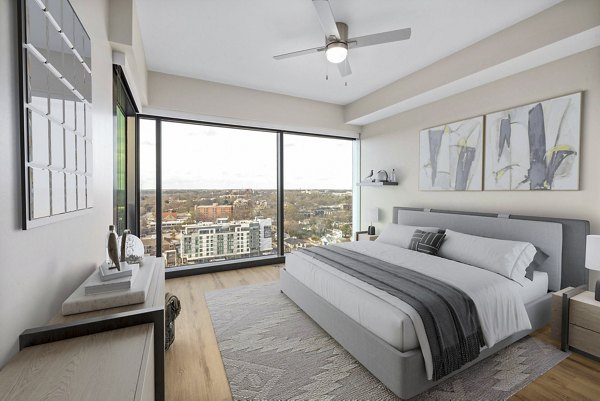 Inviting bedroom with modern decor and natural light at 400H Apartments, a Greystar luxury property in the heart of the city