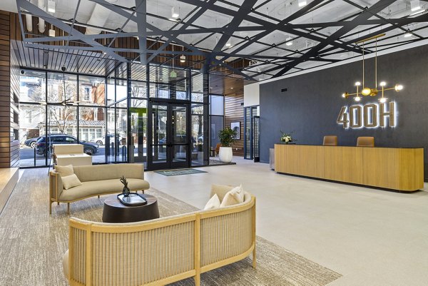 Clubhouse lobby featuring modern decor and seating at 400H Apartments, ideal for socializing and relaxation