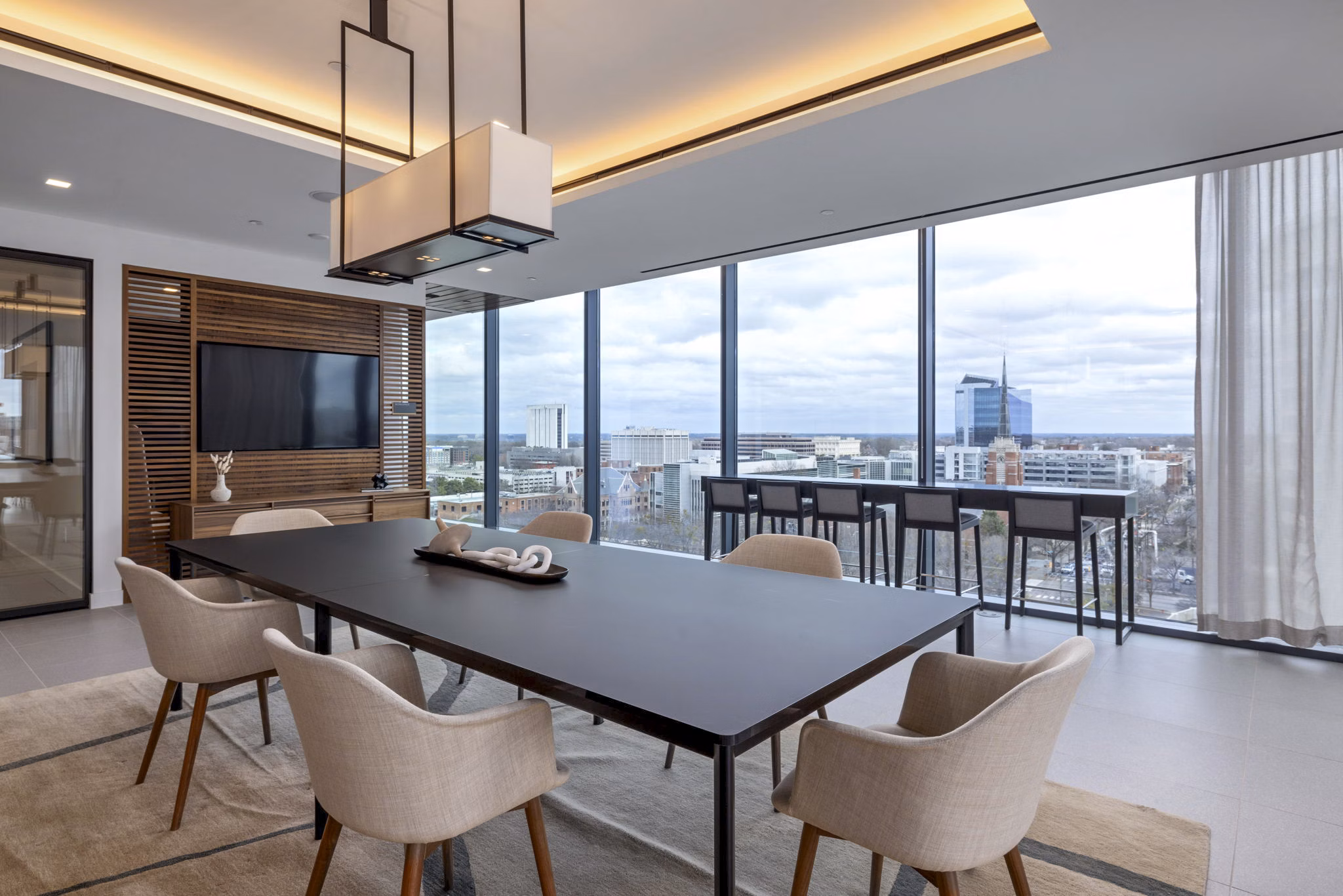 Clubhouse lounge with modern seating and decor at 400H Apartments