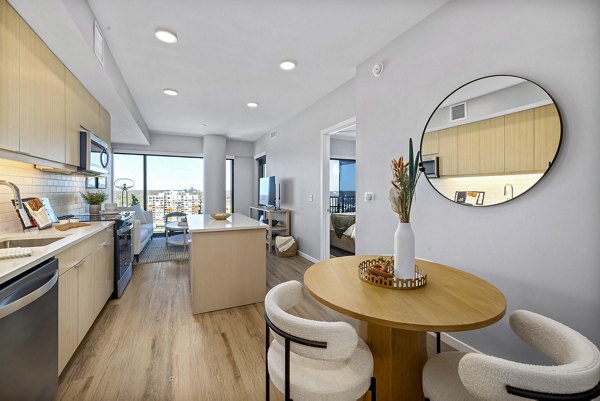 Dining room with modern decor and elegant lighting at 400H Apartments in Raleigh, NC, offering luxury living spaces.