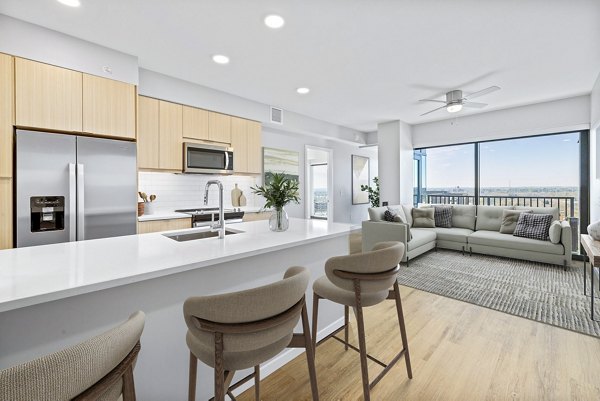 Modern kitchen with stainless steel appliances in 400H Apartments, a Greystar luxury apartment