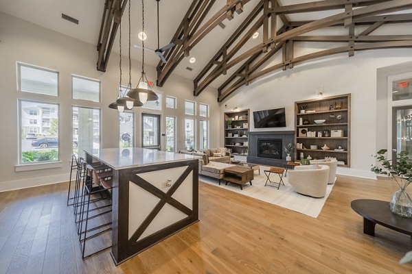 Clubhouse with modern decor and pool table at Pringle Square Apartments Perfect space for resident gatherings and social events